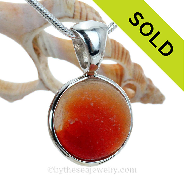 A multi color sea glass marble is expertly set in our Original Wire Bezel© setting.