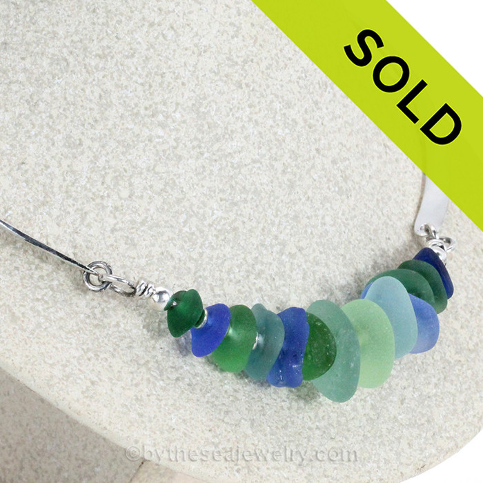 13 pieces of genuine sea glass on  a silver necklace