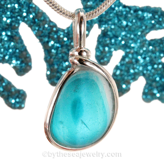 A vivid deep Electric Aqua Mixed English Multi sea glass set for a necklace in our Original Sea Glass Bezel© in solid sterling silver setting.