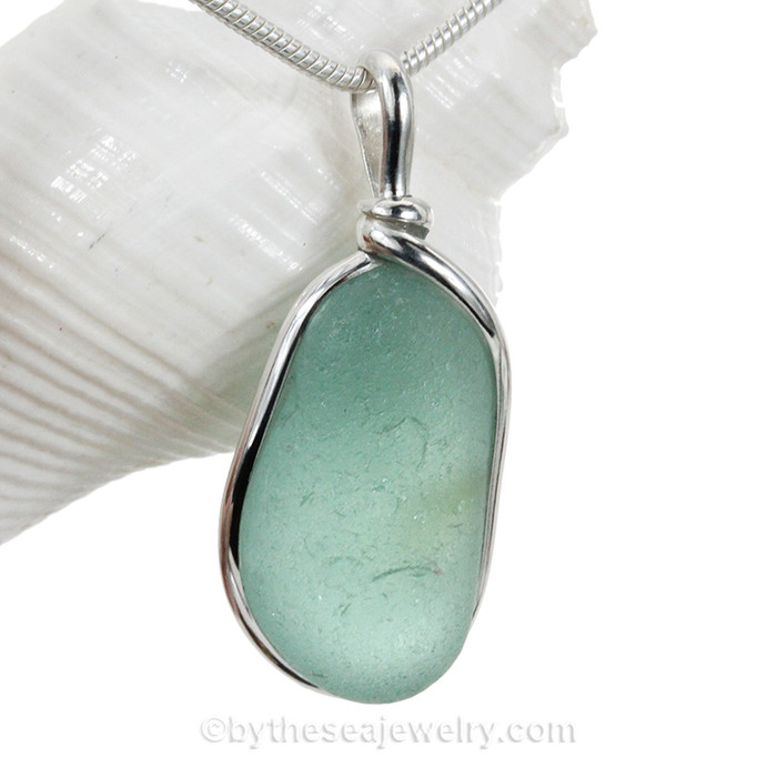 Aqua beach found sea glass from is set in our Original Wire Bezel© pendant 