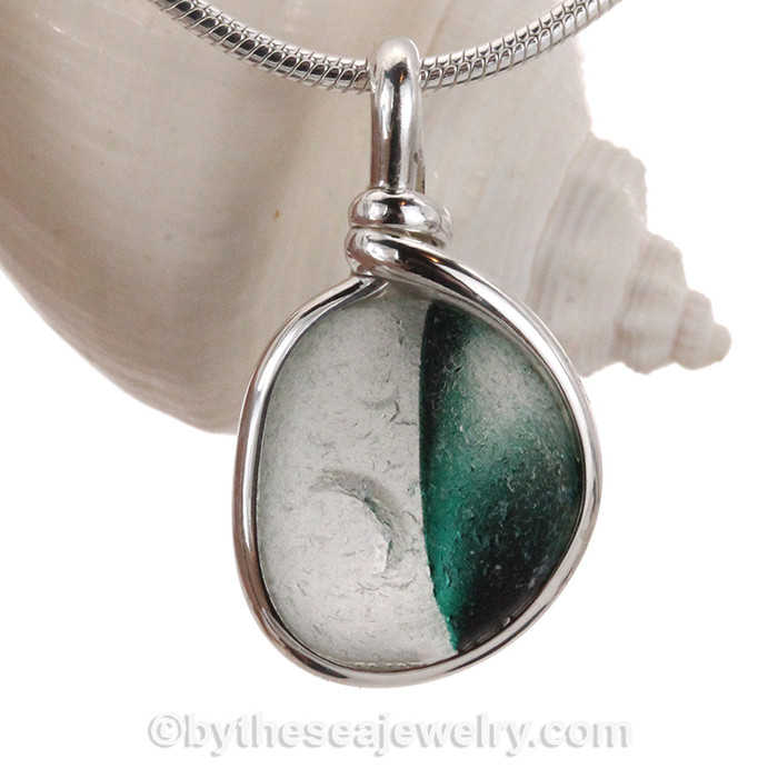 Very 3 dimensional colors that are fused inside this 150 year old sea glass piece found in Seaham England.