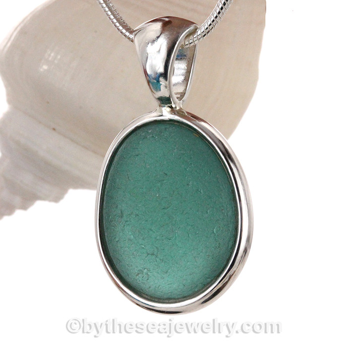 Aqua sea glass from Seaham England set in our Deluxe Wire Bezel© necklace pendant setting.