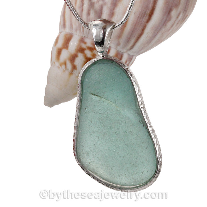 A STUNNING HUGE piece of Bright Aqua Certified Genuine Sea Glass Pendant in our Deluxe Wire Bezel© setting in a Sterling Silver pattern wire.