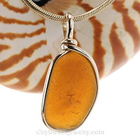 bright brown sea glass pendant set in gold