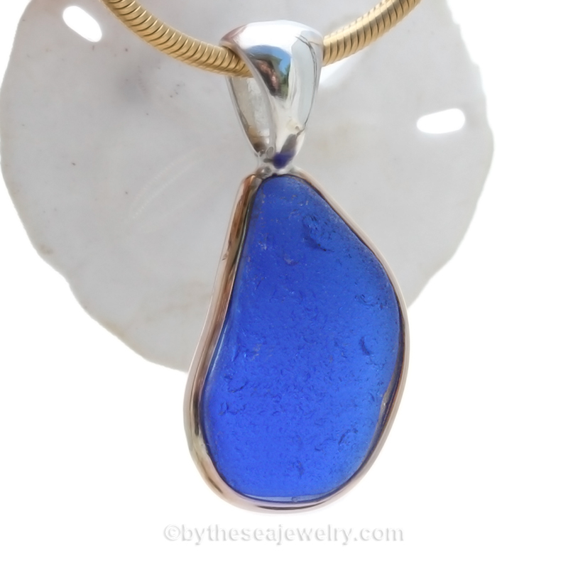 blue sea glass pendant in tiffany deluxe (gold and silver) bezel setting
