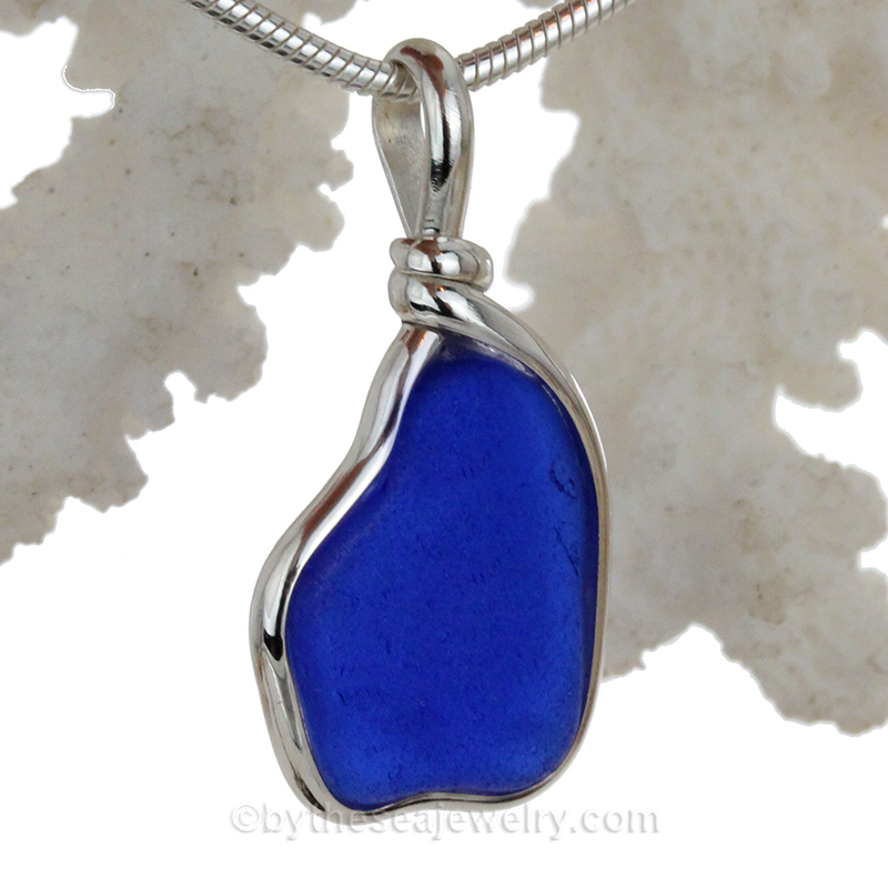 blue sea glass pendant in tiffany deluxe (gold and silver) bezel setting