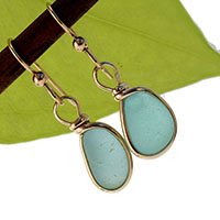 sea glass earrings using aqua sea glass and set in gold bezel