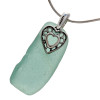 A large piece of natural vivid aqua sea glass set on a solid sterling hand cast bail with a sterling silver heart in hearts charm. A perfect sea glass necklace for any sea glass lover!