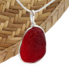 A once in a lifetime piece of large bright red sea glass is set in our Original Wire Bezel© pendant setting.
One of the largest red  sea glass pieces we have ever offered for sale.