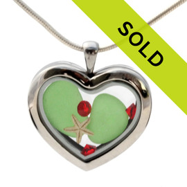 Vivid Green beach found sea glass pieces combined with a real starfish and bright red gems in a feminine heart shaped locket magnetic stainless steel locket necklace! 
Sorry this sea glass jewelry item has been sold!