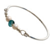 Vivid mixed aqua beach found sea glass combined with real cultured pearls on this solid sterling silver half round sea glass bangle bracelet. Real cultured pearls make the a great choice for a beach wedding or June beach baby!