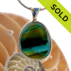 AN ULTRA RARE Mixed Olive Green & Electric Vivid Aqua Genuine Rare English Sea Glass piece set in our Deluxe Wire Bezel© necklace pendant setting.
SOLD - Sorry This ULTRA RARE Sea Glass Necklace Pendant Is NO LONGER AVAILABLE!