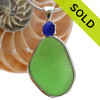 This beautiful Vivid Green glass piece is set in our Deluxe Wire Bezel© pendant setting with a small cobalt blue prong set sea glass focal point.
Sorry this Sea Glass Pendant is no longer available.