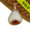 An amazing vivid golden amber in a pure white base. This piece was once the tip of a punty or pontil rod used to gather and work glass in the kiln. The color being worked was the rich amber at the bottom.
SOLD - Sorry this Rare Sea Glass Pendant is NO LONGER AVAILABLE!