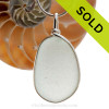 A larger and flatter piece of antique English Sea Glass in pure white in a solid sterling silver pendant in our Original Wire Bezel© setting.
SOLD - Sorry this Sea Glass Pendant is NO LONGER AVAILABLE