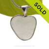 A beautiful White natural sea glass heart set in our deluxe wire bezel pendant setting! 
Genuine sea glass hearts are a RARE phenomena and cherished among sea glass lovers!
SOLD - Sorry this Rare Sea Glass Pendant is NO LONGER AVAILABLE!