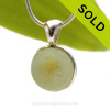 A Genuine Beach Yellow Catseye Found Sea Glass Marble set in our Deluxe Solid Sterling Deluxe Bezel setting. Our Deluxe Wire Bezel© setting combing a sterling bezel wire and cast solid silver bail for a rich elegant look. 
SOLD - Sorry this Rare Sea Glass Pendant is NO LONGER AVAILABLE!