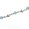 Stunning pearls and aquamarine gems make this a great choice for any beach bride.