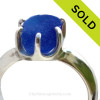 A spectacular piece of Vivid Cobalt Blue English Sea Glass set in a sturdy 6 prong Solid Sterling ring setting.

The sea glass is totally UNALTERED from the way it was found on the beach in England. It can take many hours of sorting through sea glass to find the perfect piece to fit a particular setting.
SOLD - Sorry this Sea Glass Ring is NO LONGER AVAILABLE!