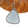 This is a beautiful LARGE Baby Blue Sea Glass set in our Solid Sterling Original Wire Bezel© pendant setting .