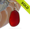A once in a lifetime piece of large fire red sea glass is set in our Original Wire Bezel© pendant setting.