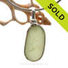 This is a P-E-R-F-E-C-T piece of light Perdiot Green Sea Glass Jewelry set in our Original Wire Bezel© pendant setting in Sterling Silver .
This is our signature Original Wire Bezel© design that leaves the glass UNALTERED from the way it was found on the beach. Beautiful, Classic and Versatile.