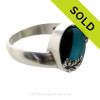 A stunning piece of Victorian Era Electric Aqua and Black Sea glass Ring in a secure Solid Sterling ring.