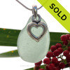 A beautiful and PERFECT beach found Seafoam Green  sea glass necklace set on a solid sterling cast bail with a sterling silver puffy Heart charm.
