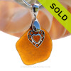 A  perfect amber honey brown genuine sea glass with a solid sterling bail and detailed heart in heart charm.
This piece comes complete with our sterling 1.2 MM snake chain.
