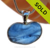 A beautiful small and rare Mixed Blue Multi color natural sea glass heart set in our deluxe wire bezel pendant setting! 
Genuine sea glass hearts are a RARE phenomena and cherished among sea glass lovers