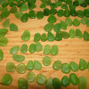 Sorting sea glass for earrings takes hours upon hours. We not only match for shape, size and color but also for degree of frost, quality and thickness. It can take hundreds of pieces of sea glass of similar size to find just one pair.