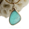 A stunning flashed aqua sea glass piece from Seaham England set in our Original Wire Bezel setting in gold!