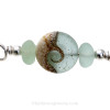 A detail of the top quality genuine sea glass pieces and the lovely handmade sea green wave bead.