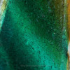 A close up detail of the piece shows you the vivid tropical aqua, green blue and a touch of gold.