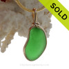 A cool perfect VIVID Glowing Green Genuine Sea Glass set in our Original Wire Bezel© setting in 14K Rolled Gold.
It has been left just as it was found and is UNALTERED from the way it was found on the beach on the Outer Banks of NC.