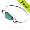 Deep Aqua Sea Glass Bangle Bracelet set in our Premium Deluxe Wire Bezel© Solid Sterling Silver .
SOLD - Sorry this Sea Glass Bangle Bracelet is NO LONGER AVAILABLE!