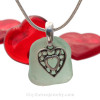 Stunning glowing Tropical Aqua Green genuine sea glass with a solid sterling bail and detailed heart in hearts charm.