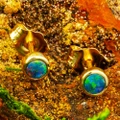 * A SOLSTICE WHISPER 14KT GOLD AUSTRALIAN OPAL STUD EARRINGS