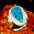 * 1 OCEAN FIRE 18KT GOLD AND DIAMOND OPAL RING