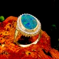 * 1 A FOREST LIGHT 18KT GOLD  AND DIAMOND OPAL RING