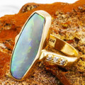 * A MINE LIGHT 14KT YELLOW GOLD & DIAMOND AUSTRALIAN OPAL RING