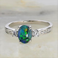 * 1 A UNIVERSE BLOOM STERLING SILVER AUSTRALIAN OPAL RING