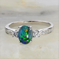 * 1 A UNIVERSE BLOOM STERLING SILVER AUSTRALIAN OPAL RING