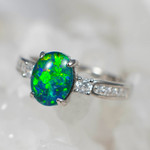   * AN UP TEMPO STERLING SILVER AUSTRALIAN OPAL RING