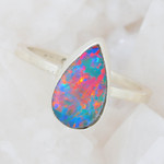   * A RAINBOW FILLED STERLING SILVER AUSTRALIAN OPAL RING