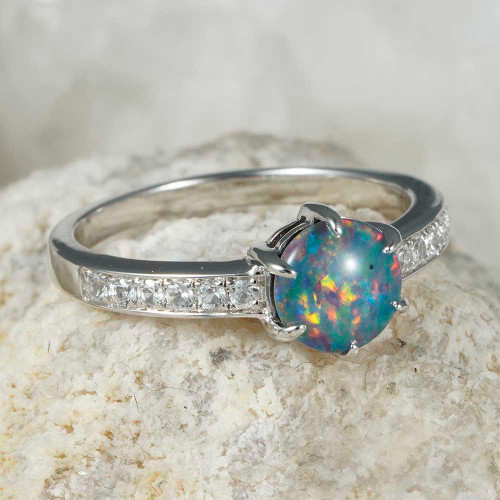 * A PRISM PETALS STERLING SILVER AUSTRALIAN OPAL RING