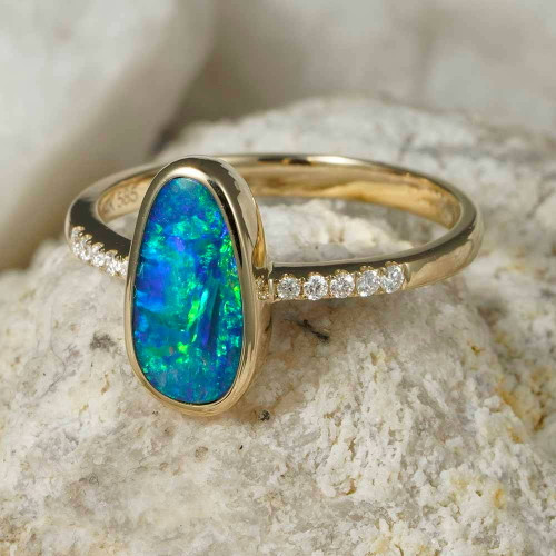 * A SPARKLING STREAM 14KT YELLOW GOLD & DIAMOND AUSTRALIAN OPAL RING