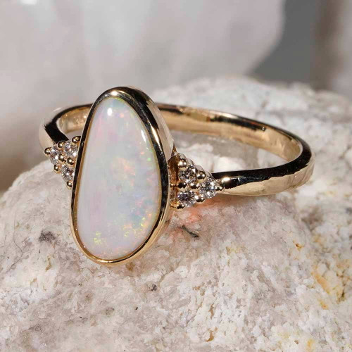 * A RADIANT REMNANT 14KT YELLOW GOLD & DIAMOND AUSTRALIAN WHITE OPAL RING