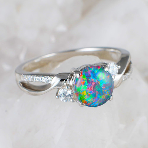 * AN ELECTRIC SIZZLE STERLING SILVER OPAL RING