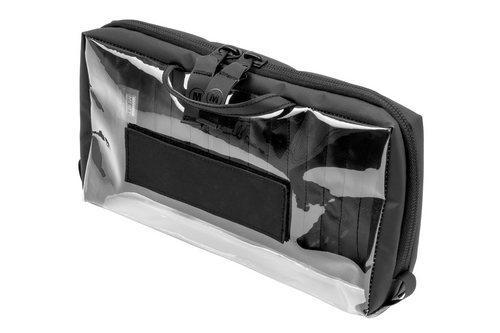 The H7 VIEWPACK ™ PRO module supports critical intervention supplies that can be accessed or deployed for trauma treatments with infection control. The wide clear pocket can be filled with a variety of IV, tourniquets, wound packing, or other trauma supplies. Custom label the front panel for easy identification (as shown). The front quick-grab handle allows you quickly remove the module and pass it to a team member, or clip the side loop onto a carabiner. Bottom velcro attaches to the SAVIOR7, or use the rear backside velcro webbing straps to attach it to any MOLLE compatible gear. Constructed internally and externally from non-absorbing infection control materials designed specifically to easily clean and remove blood borne pathogens.`